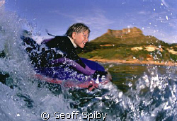 the excitement of riding a wave shows on the face of this... by Geoff Spiby 